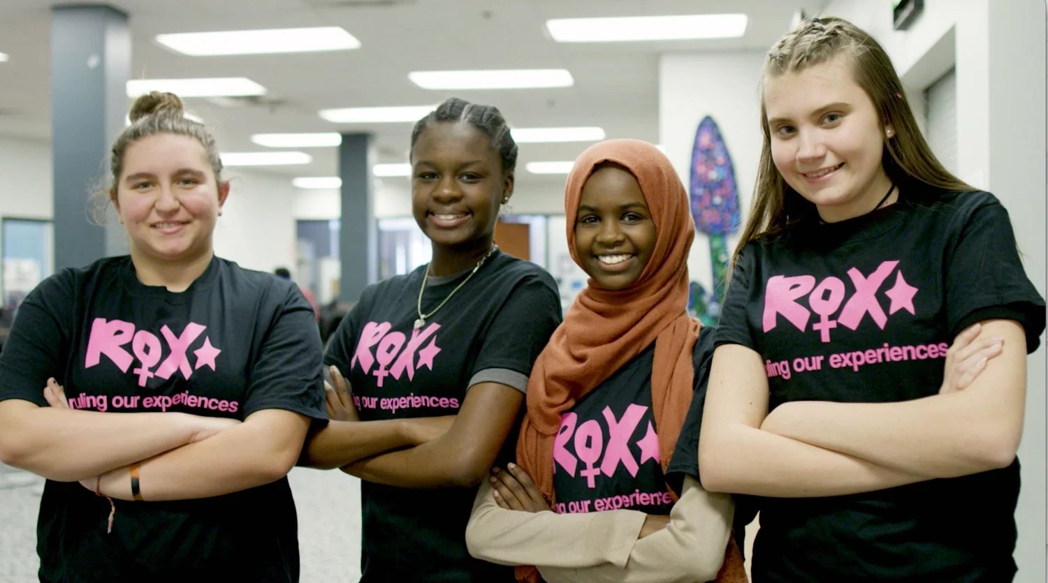 Four ROX girls smiling at the camera